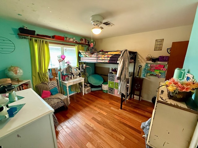 bedroom with visible vents and light wood-type flooring