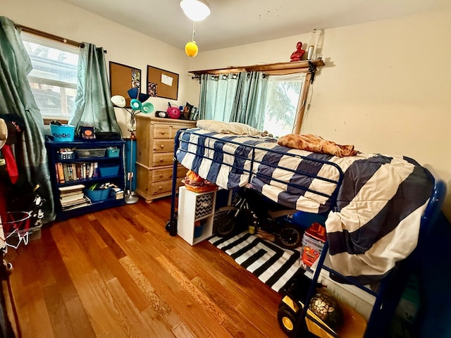 bedroom with wood finished floors