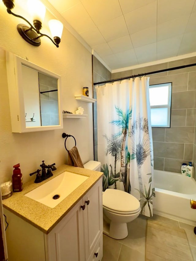 full bath featuring tile patterned flooring, toilet, shower / bath combo, ornamental molding, and vanity