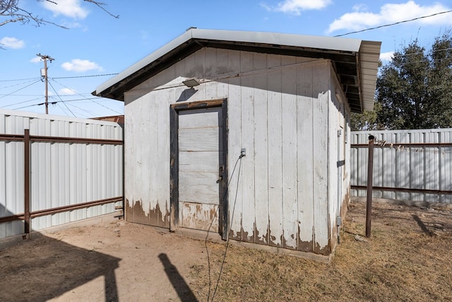 view of shed with fence