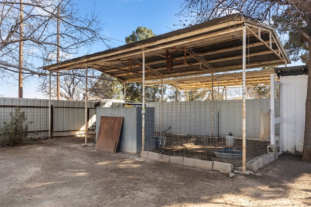 view of patio featuring an outbuilding and exterior structure