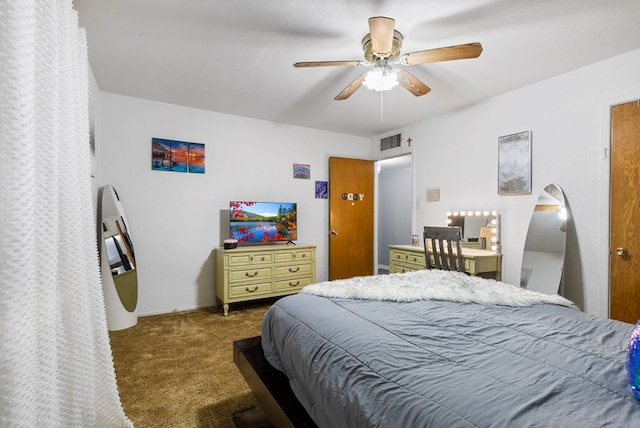 carpeted bedroom with visible vents and a ceiling fan