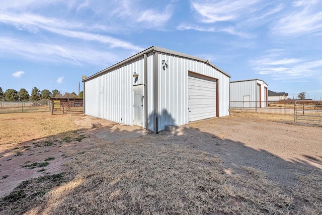 garage featuring a rural view