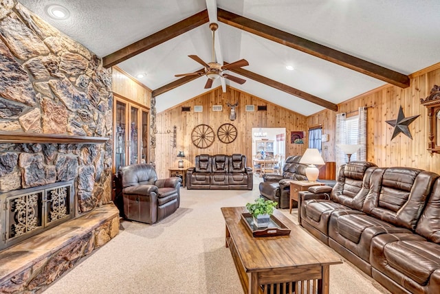 living room featuring a fireplace, carpet floors, lofted ceiling with beams, and wood walls