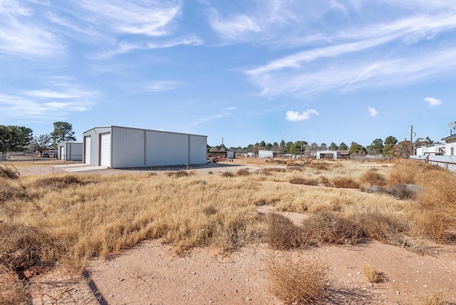 view of yard with an outbuilding and a garage