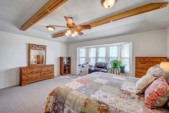 bedroom featuring light carpet, ceiling fan, and a textured ceiling