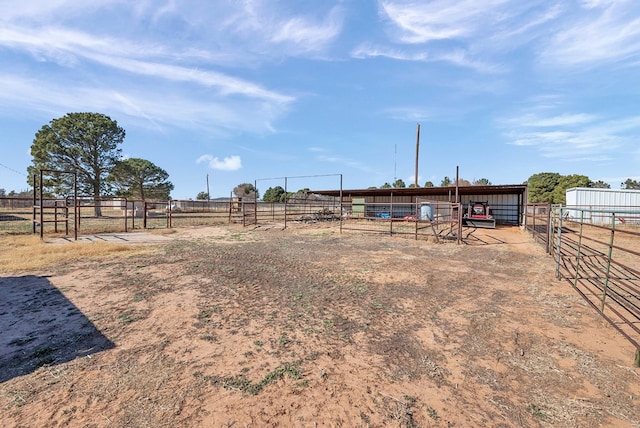 view of yard featuring an outbuilding and a rural view