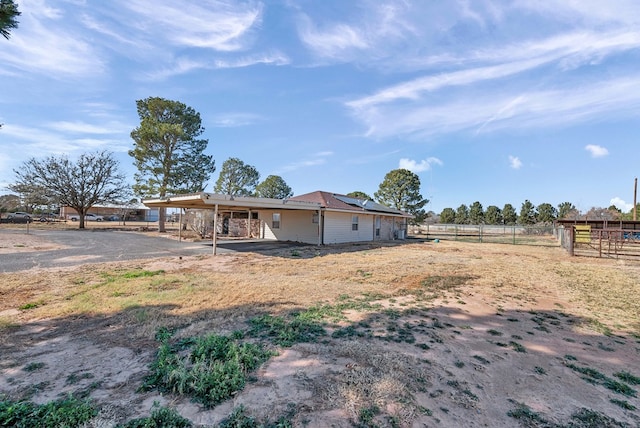 exterior space with a patio and a rural view