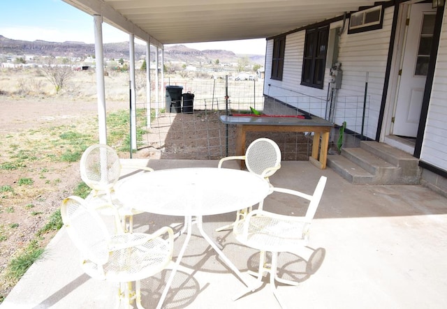 view of patio / terrace with a mountain view