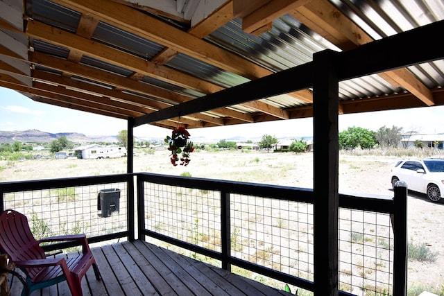 wooden deck with a mountain view