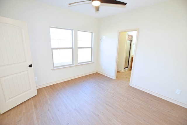 spare room with ceiling fan and light hardwood / wood-style floors