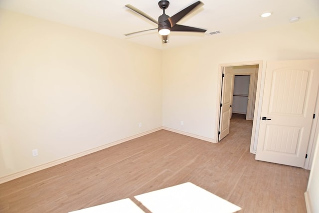 unfurnished room with ceiling fan and light hardwood / wood-style flooring