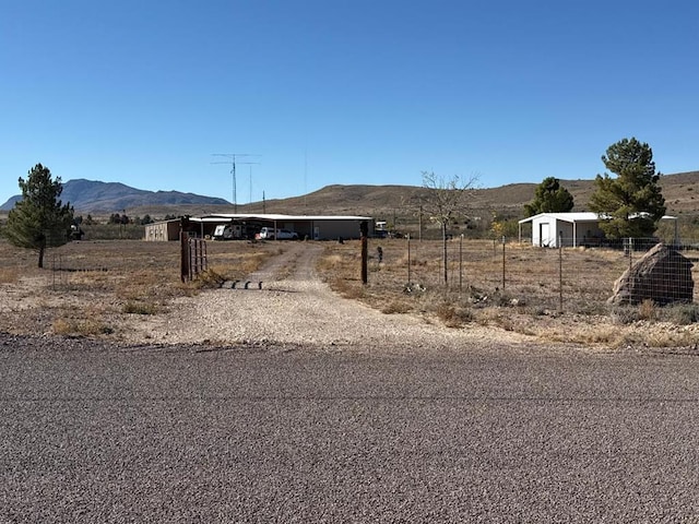 view of street featuring a mountain view and a rural view