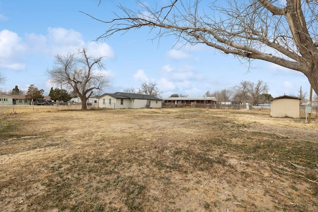 view of yard with a residential view and fence