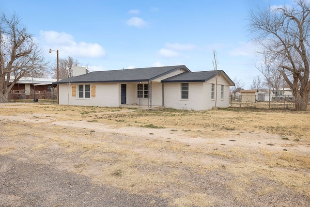 back of property with fence