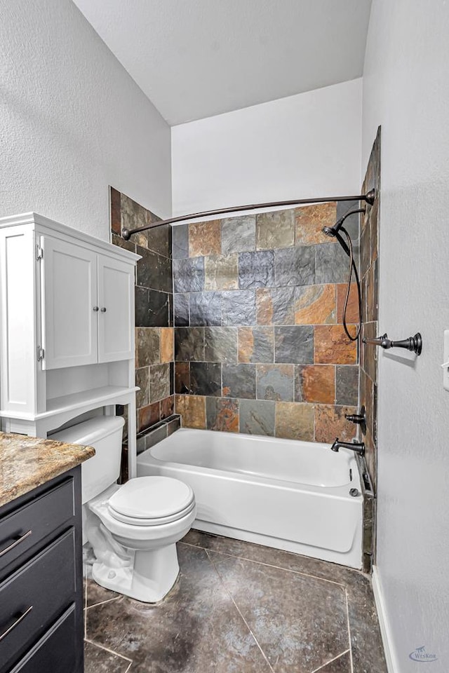 full bath with shower / bath combination, a textured wall, toilet, and vanity