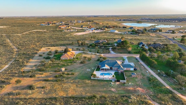 aerial view with a water view and a rural view