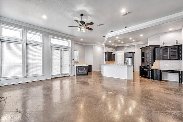 unfurnished living room with a ceiling fan, recessed lighting, visible vents, and crown molding