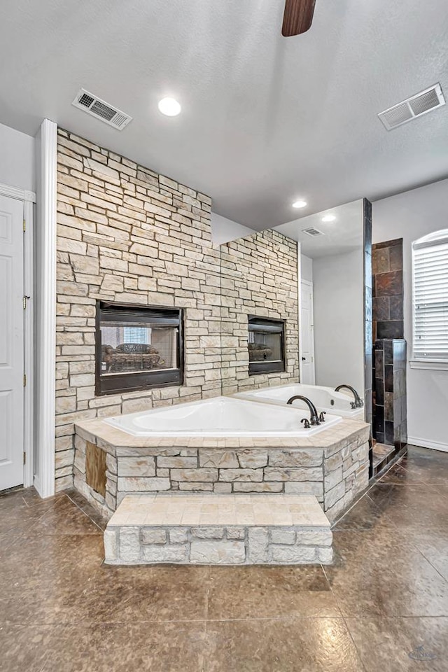 full bath with a textured ceiling, visible vents, a walk in shower, and a bath