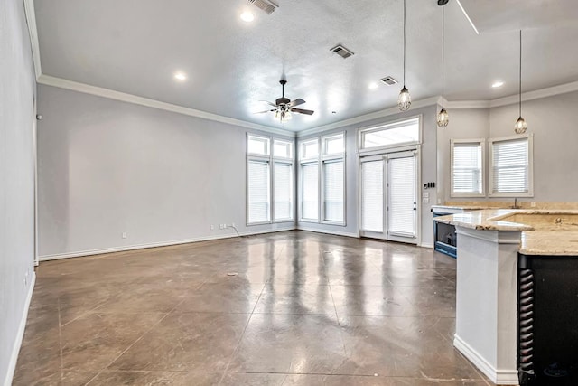 unfurnished living room with baseboards, ornamental molding, and a healthy amount of sunlight