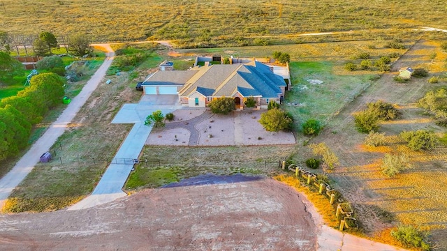 birds eye view of property with a rural view