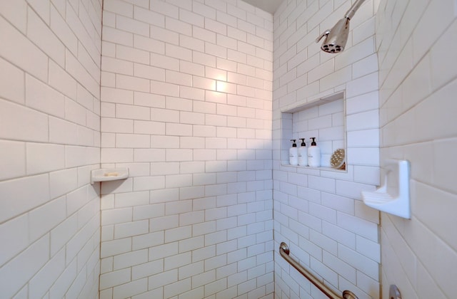 bathroom with tiled shower