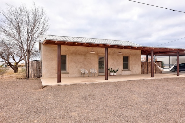 back of house with a patio