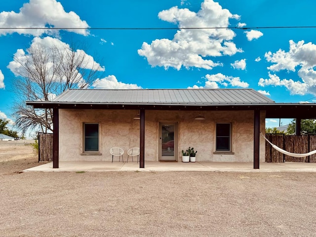 rear view of house with a patio