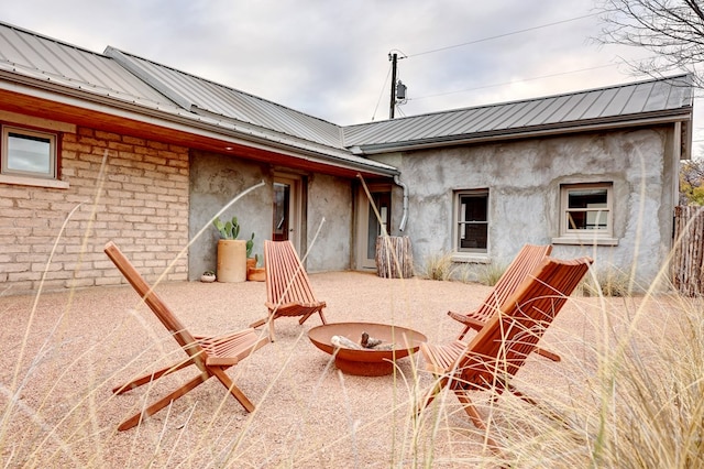 view of patio featuring an outdoor fire pit