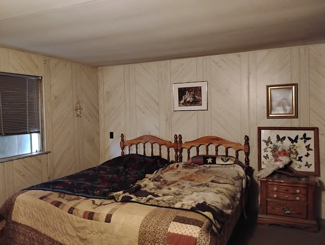 bedroom with wooden walls