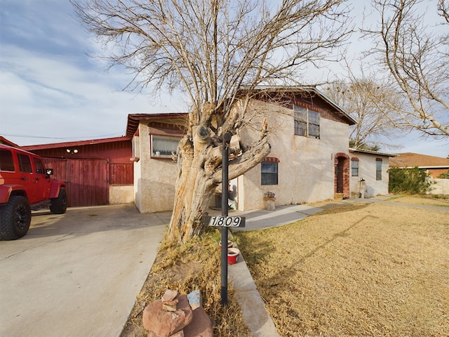 view of home's exterior featuring a yard