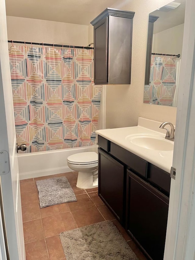 full bathroom with vanity, toilet, and shower / tub combo