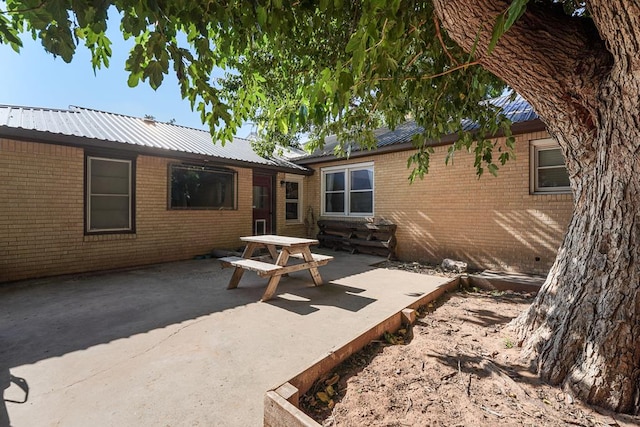 back of property with a patio area