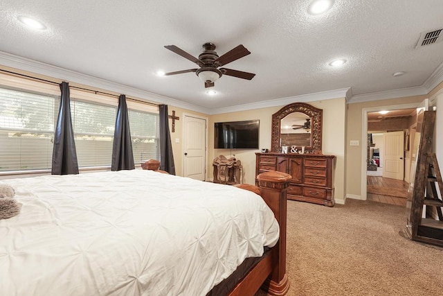 carpeted bedroom with ceiling fan, a textured ceiling, and ornamental molding