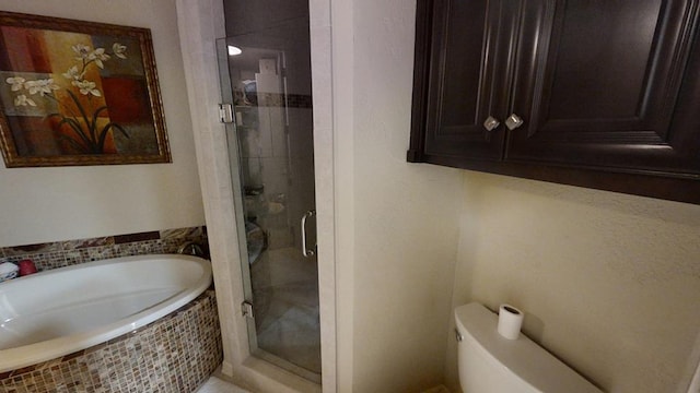 bathroom with shower with separate bathtub and toilet