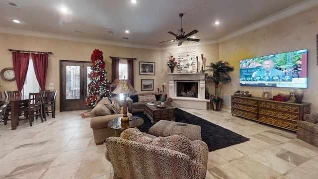 living room featuring ceiling fan and crown molding