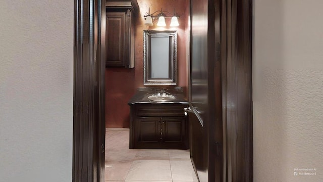 bathroom featuring tile patterned floors and vanity