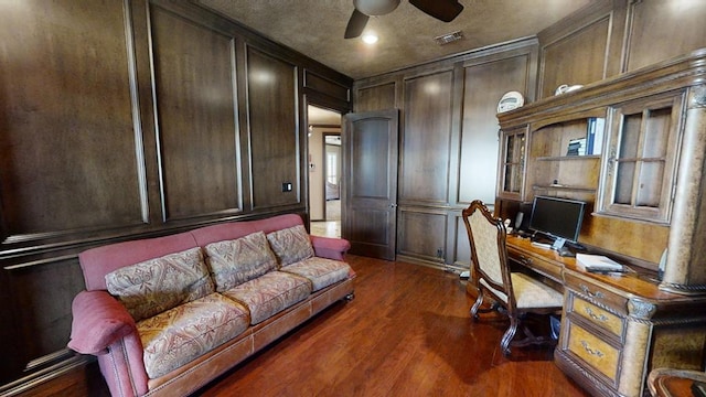 home office featuring ceiling fan and dark hardwood / wood-style floors