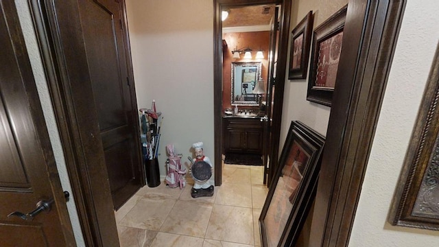 corridor featuring light tile patterned floors