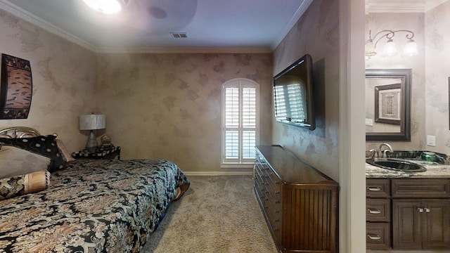 bedroom with light colored carpet, ornamental molding, and sink