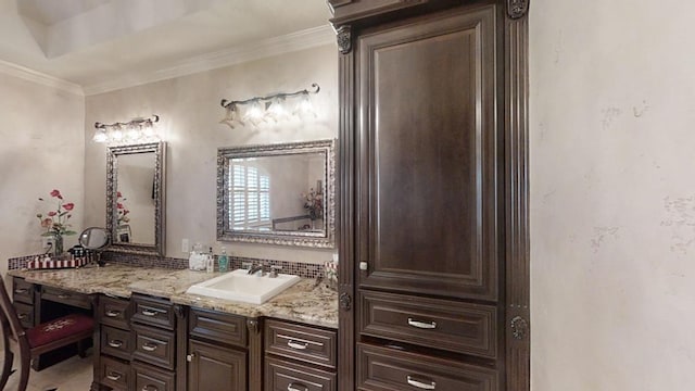 bathroom with vanity and ornamental molding