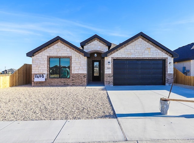 view of front of property with a garage