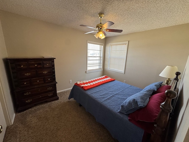 bedroom with baseboards, carpet floors, a textured ceiling, and a ceiling fan