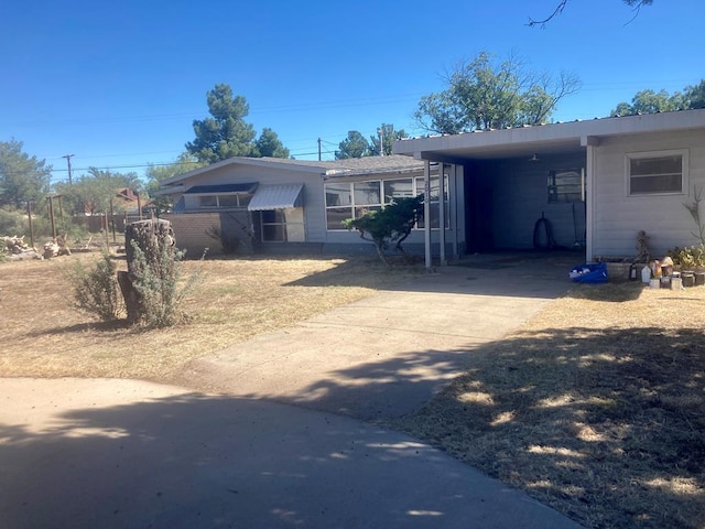 view of front of property with a carport