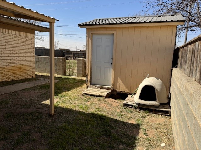 view of shed featuring a fenced backyard