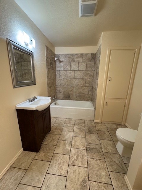 bathroom with a textured ceiling, toilet, bathing tub / shower combination, vanity, and baseboards