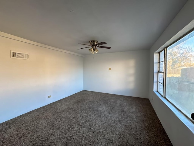 carpeted empty room with ceiling fan