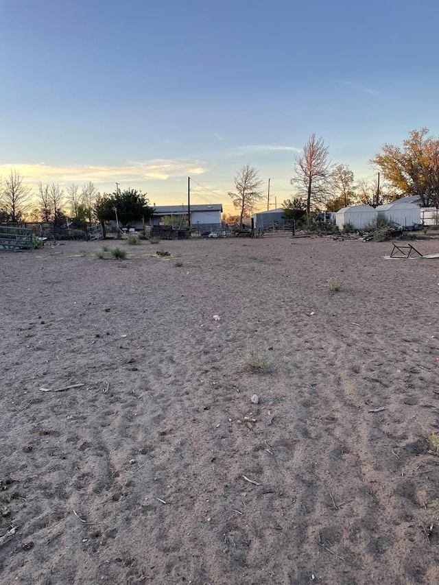 view of yard at dusk