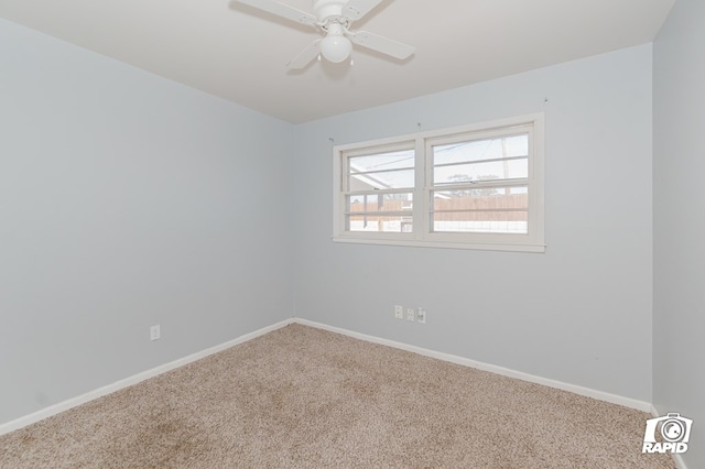 unfurnished room with carpet flooring, ceiling fan, and baseboards