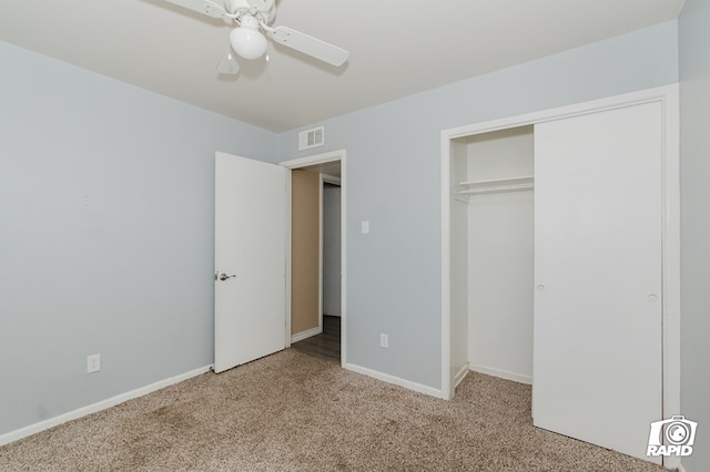 unfurnished bedroom with baseboards, visible vents, ceiling fan, carpet flooring, and a closet